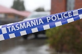 Tasmania Police tape at crime scene.
