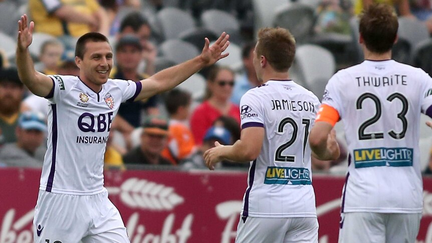 Nebojsa Marinkovic celebrates with team-mates after scoring for Perth Glory against Central Coast