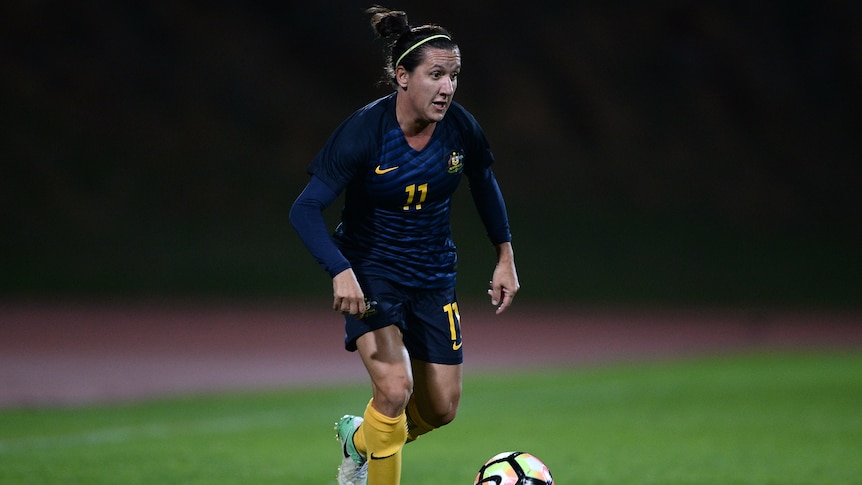 An Australian female footballer with the ball during a national match against China in Portugal.