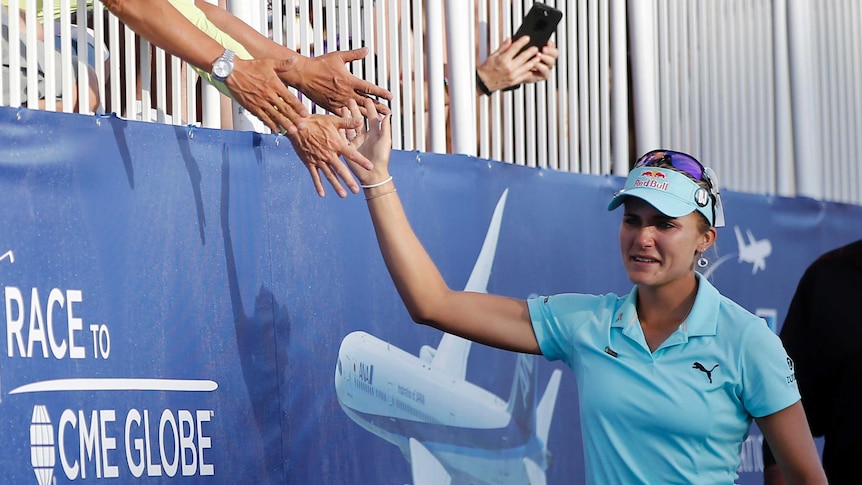 Lexi Thompson high-fives fans at the ANA Inspiration