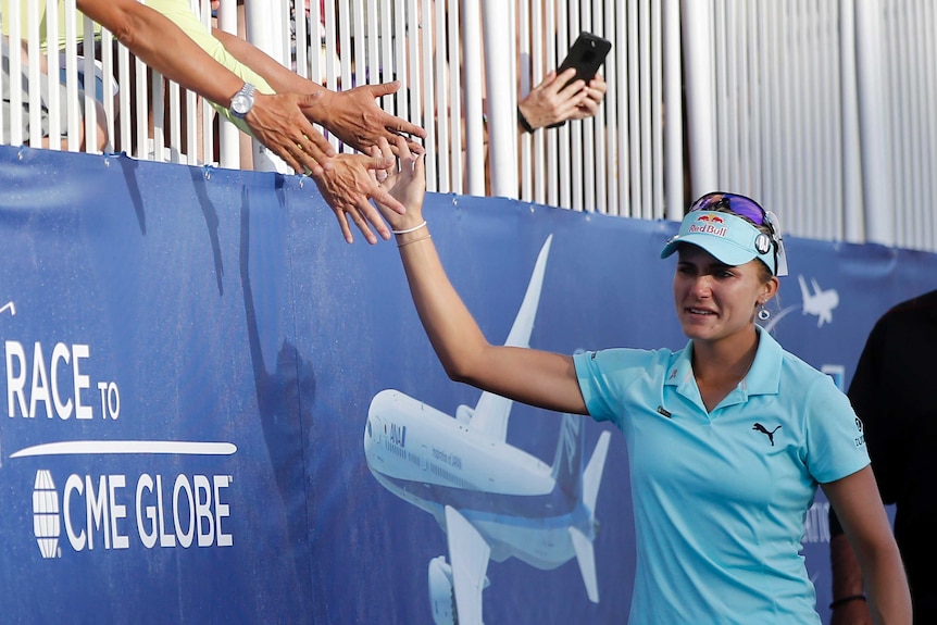 Lexi Thompson high-fives fans at the ANA Inspiration