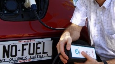 He stands by the car with the license plate 'No Fuel'