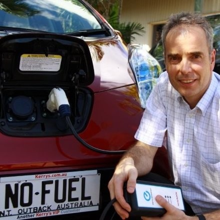 He stands by the car with the license plate 'No Fuel'
