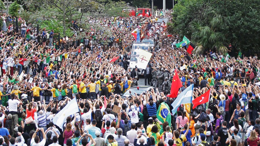 People flock to see Pope Francis as he travels through Rio de Janeiro