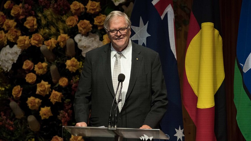 Kim Beazley stands at a podium to speak at Bob Hawke's memorial service