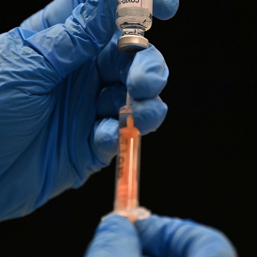 A healthcare professional draws up a dose of the Covid-19 vaccine.
