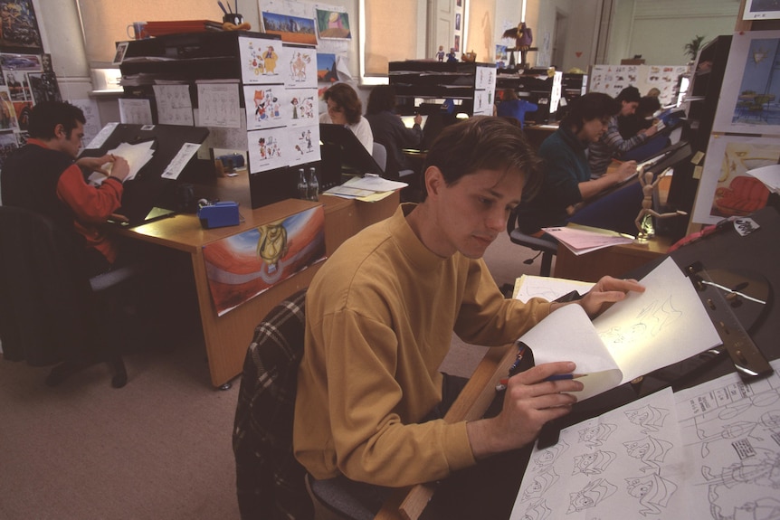 Animation artists at work in a room.