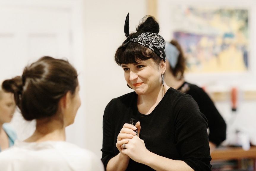 Alison Swanston laughing while doing make-up, she runs a successful small business in country Australia.