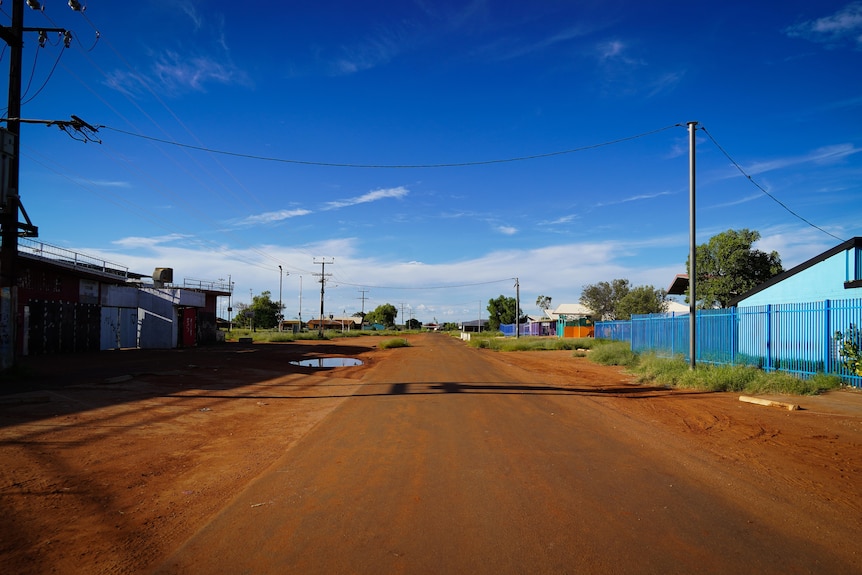 A deserted red dirt street