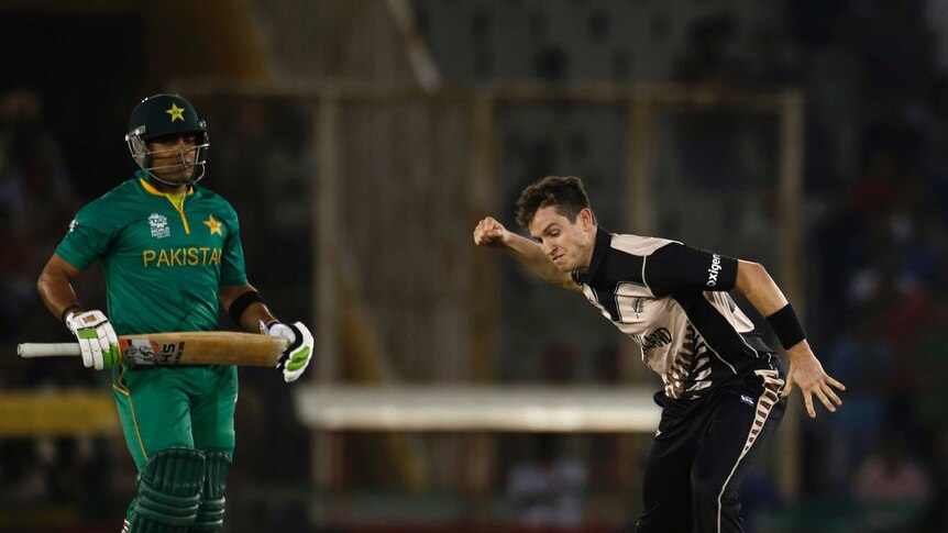 New Zealand's Adam Milne celebrates after taking the wicket of Pakistan's Umar Akmal