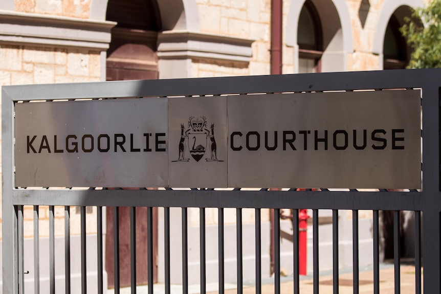 A sign at the entrance to the Kalgoorlie Courthouse displaying the WA coat of arms.