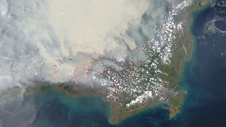 Orbital view of smoke blanketing the Indonesian island of Borneo.