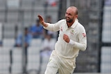 Nathan Lyon runs alone after taking a wicket against Bangladesh.