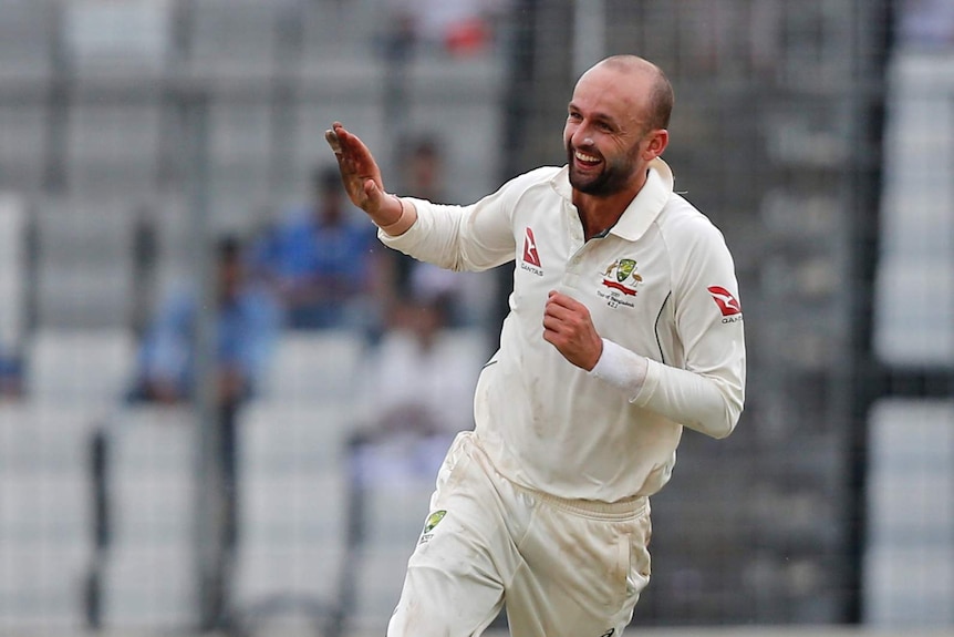 Nathan Lyon runs alone after taking a wicket against Bangladesh.