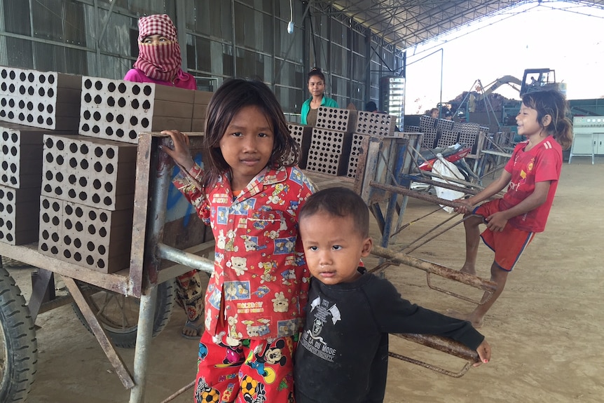Children playing in brick factory north of Phnom Penh