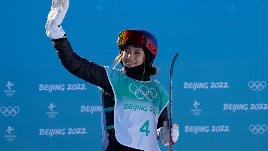 Skier waves to the crowd during the Olympic Games