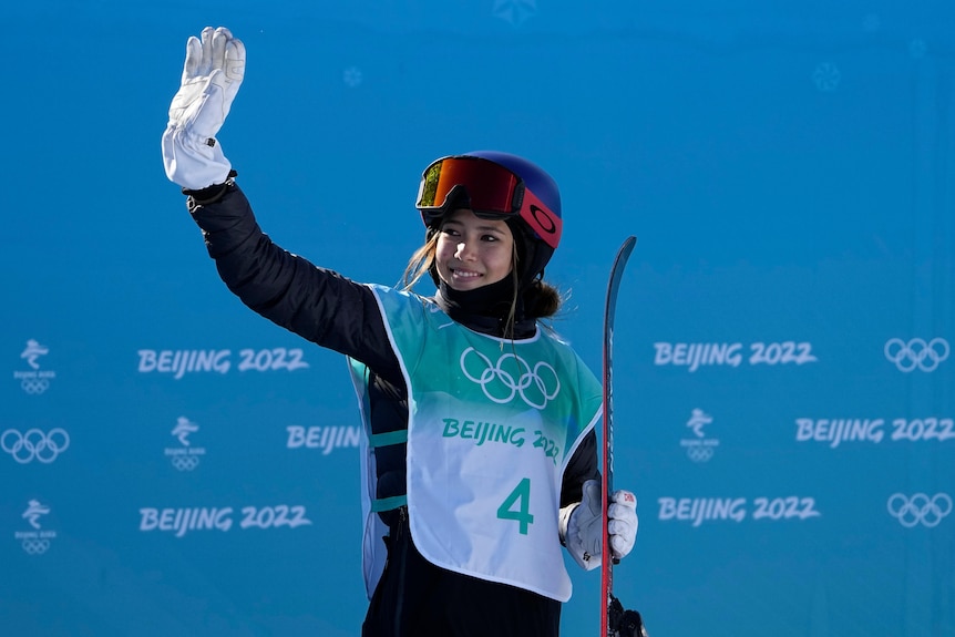 Skier waves to the crowd during the Olympic Games