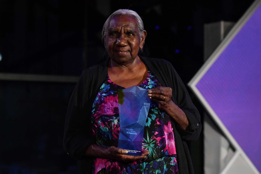 Miriam-Rose smiles after receiving her award.