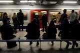 Passengers wait for the london underground train