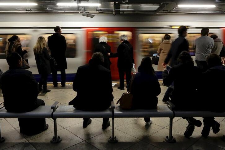 Passengers wait for the london underground train