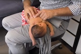 Melbourne chiropractor Ian Rossborough treats a four-day-old baby in a video on his YouTube channel.