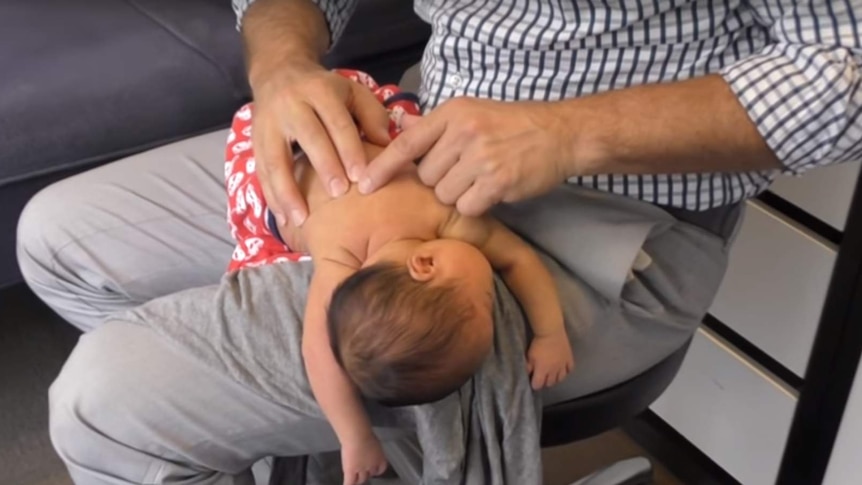 Melbourne chiropractor Ian Rossborough treats a four-day-old baby in a video on his YouTube channel.