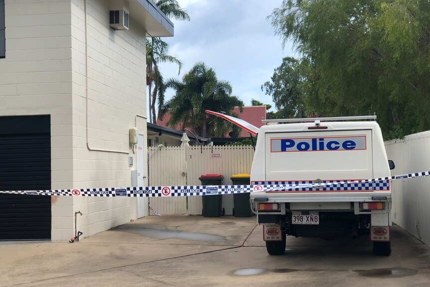 a police car is parked in the driveway of a home