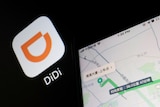 A company's logo of a stylised upside down "D" sits next to a street map showing informaiton in Chinese characters.