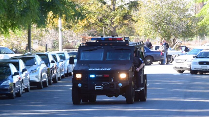 Police converge on Inland Regional Center via van