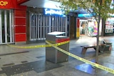 Crime scene table wrapped around a bin blocking off parts of Rundle Mall
