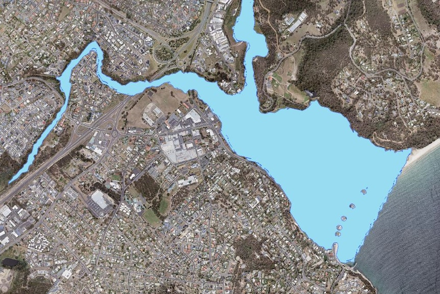 A satellite map showing a large are of blue representing water that could overflow from a dam into a residential area