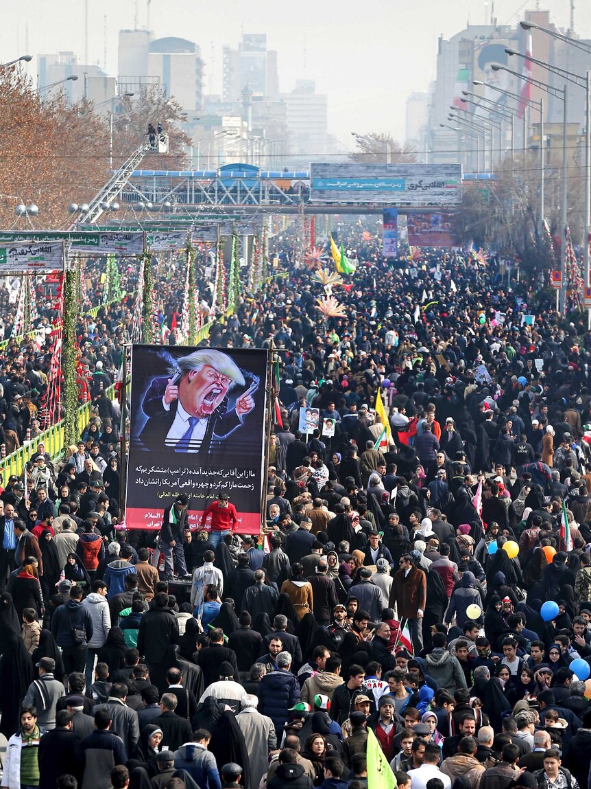 Hundreds of thousands of demonstrators march in central Tehran.