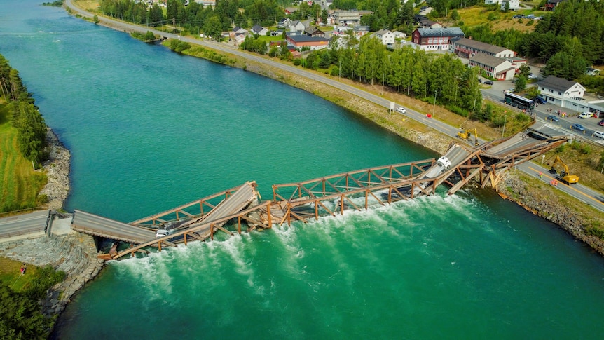 Drone footage shows the collapsed wooden bridge spanning the River Laagen in Norway