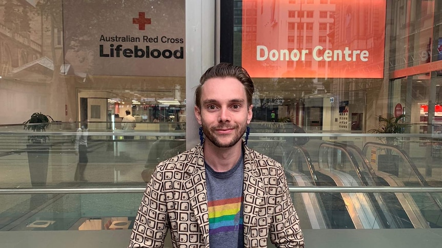 Image of Daniel Cottier in front of a blood donation centre