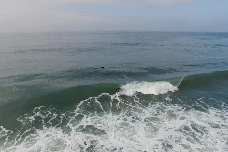 Aerial shot of surfers on Assinie