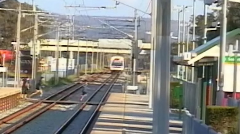 A train approaches a station.