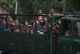 The newly-released inmates ride on a truck inside Myanmar's Insein prison following a prisoner release in Yangon on July 30, 2015