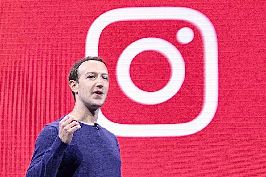 Facebook CEO Mark Zuckerberg in front of an Instagram logo