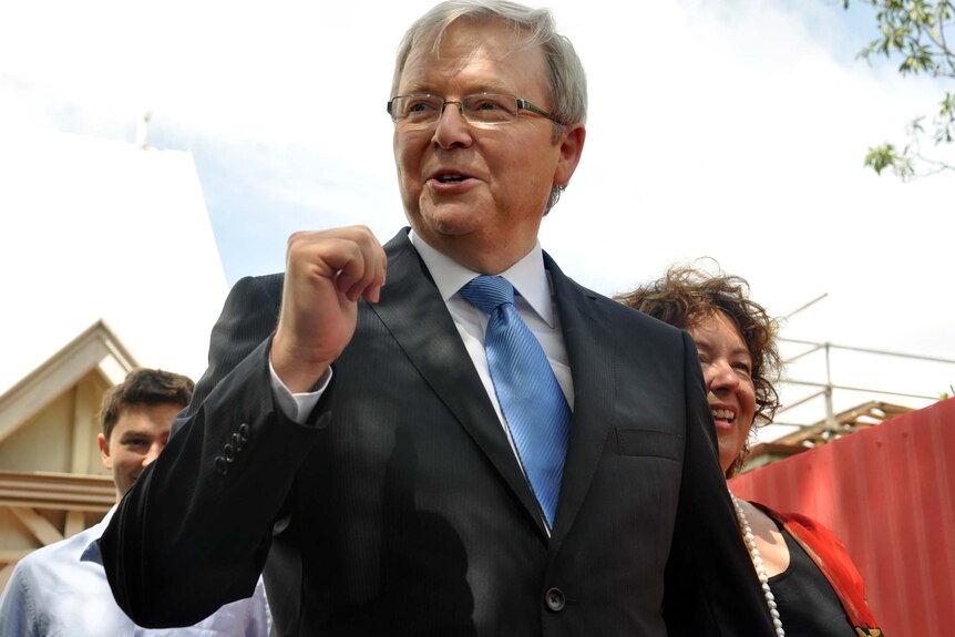 Kevin Rudd leaves church in Brisbane, with wife Therese Rein