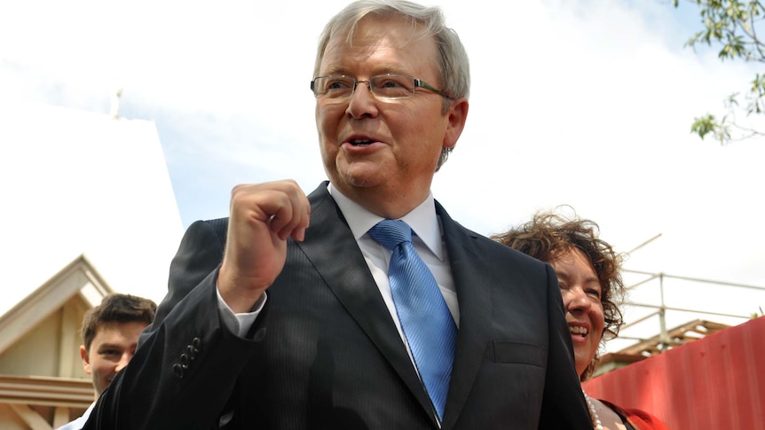 Kevin Rudd leaves church in Brisbane, with wife Therese Rein