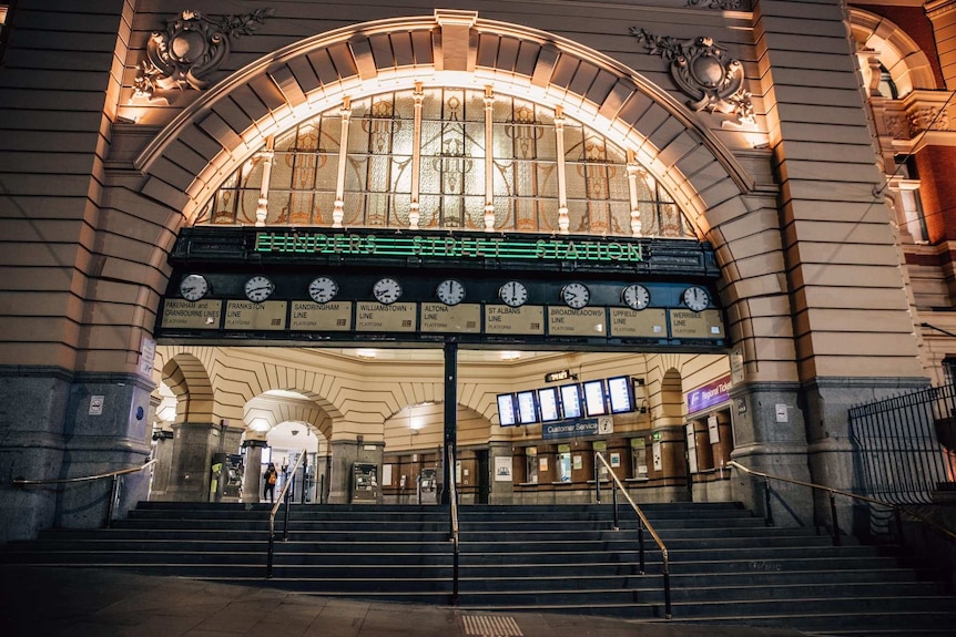 The entrance to Flinders Street Station is shown deserted at night.