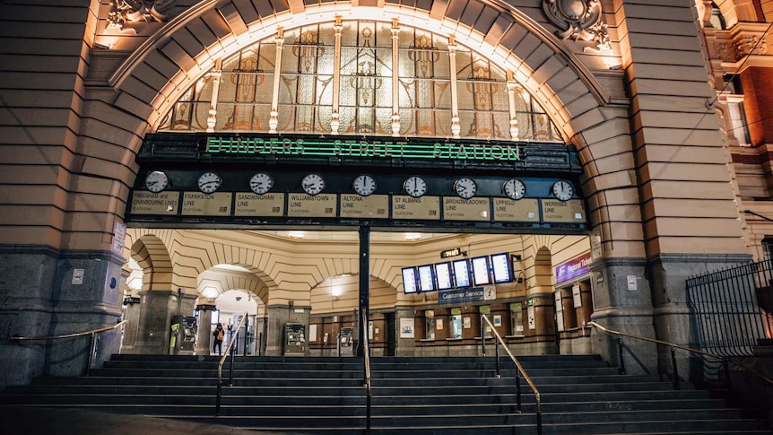 The entrance to Flinders Street Station is shown deserted at night.