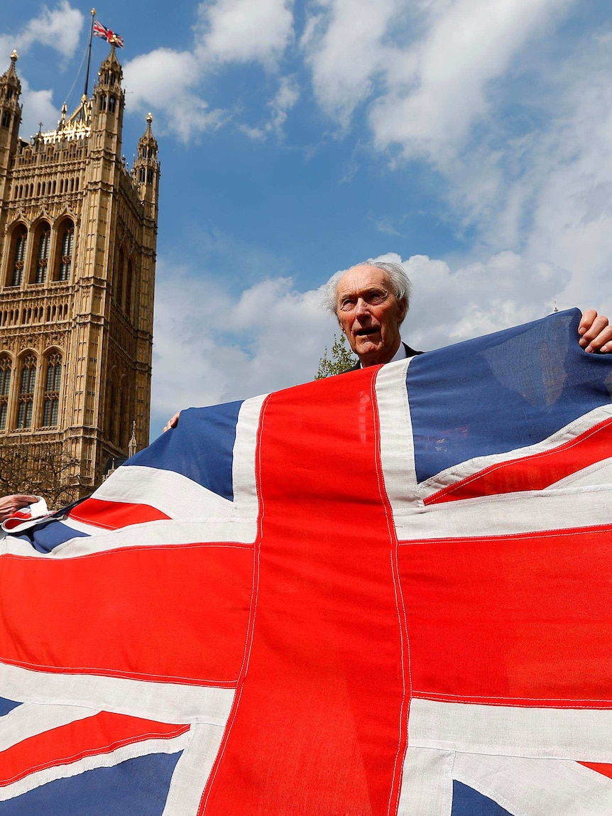 Joachim Roenneberg holds the British Union flag.