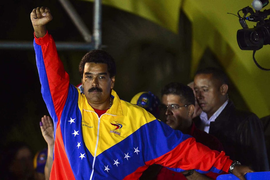 Venezuela's newly-elected president, Nicolas Maduro, gestures following the release of election results.