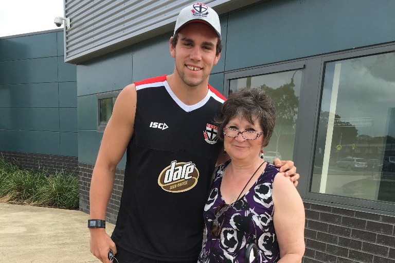 Saints player Paddy McCartin taught Yvette how to kick a football