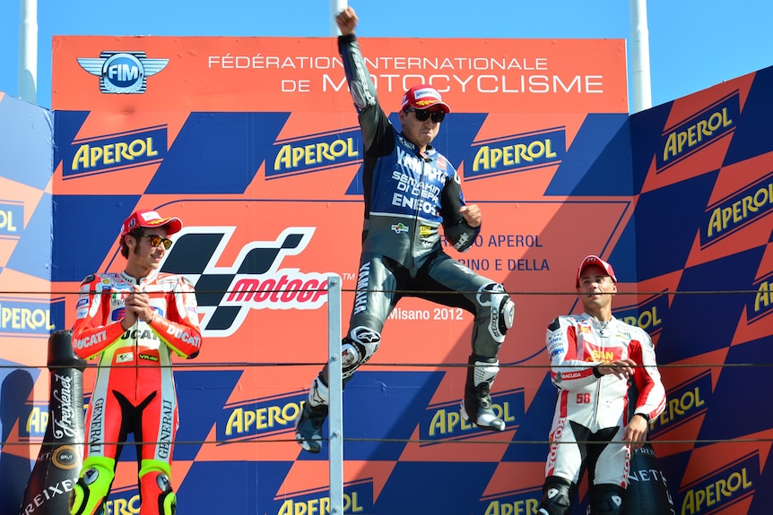 Lorenzo leaps on the podium