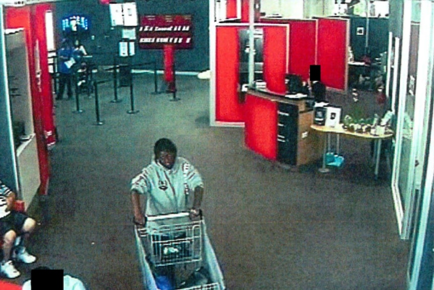 CCTV footage of a woman with a trolley in a bank