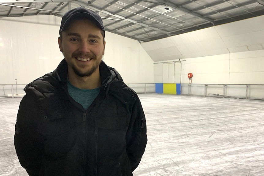 Ice skater Roman Khitiaev standing on an ice rink
