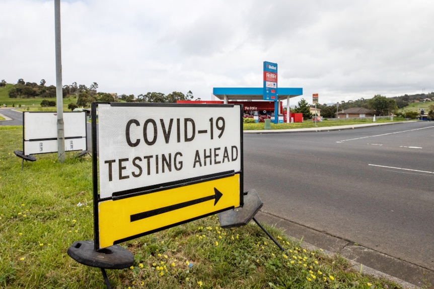 Roadside sign reads Covid-19 testing ahead