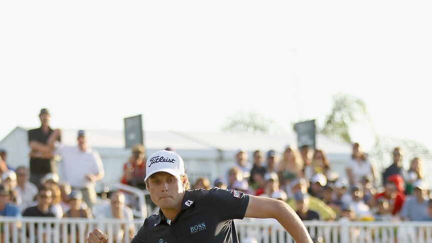 Nick Watney celebrates his birdie putt on the 18th green to clinch victory at Doral.